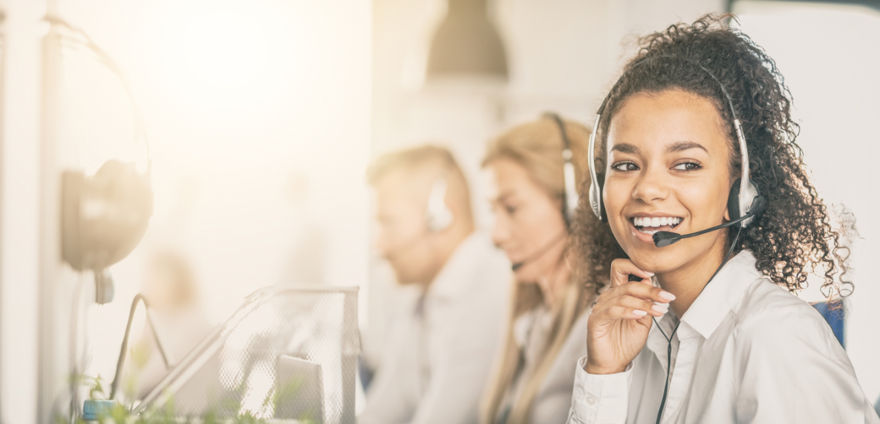 Woman with head set providing support for field sales, reimbursement, and personalized customer service