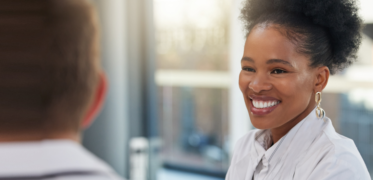 Woman smiling as she is supporting surgeon preferences on a wide range of SKUs to meet patient needs